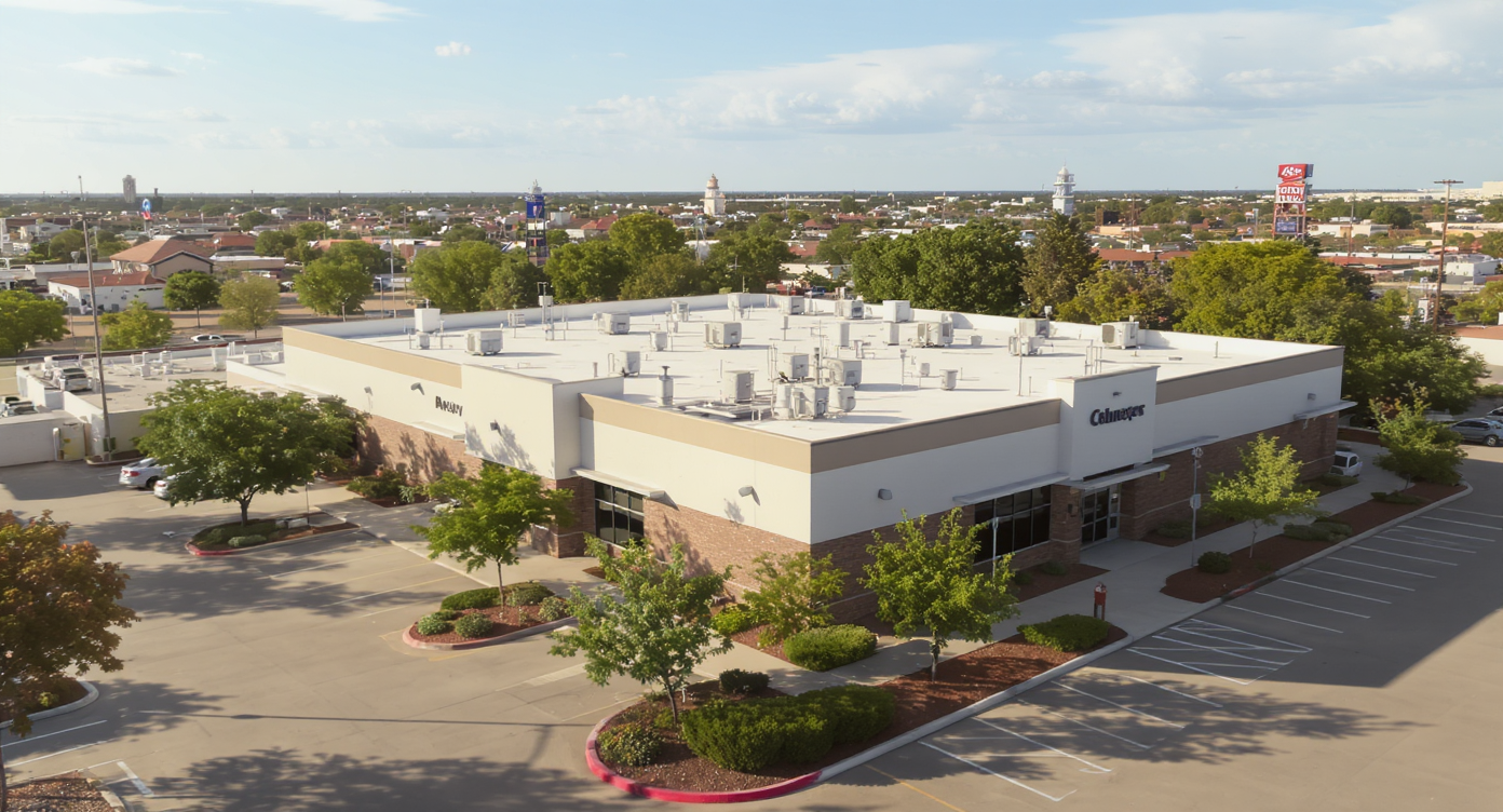 Aerial view of a Midland commercial building with a completed white TPO membrane flat roof — 5 Star Roofing