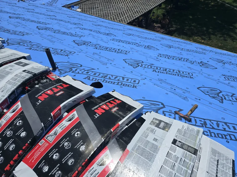 TAMKO Titan XT Class 4 impact-resistant shingle bundles staged on a roof for installation — 5 Star Roofing