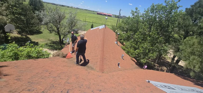 5 Star Roofing crew on a residential roof performing a free inspection in Canyon, Texas